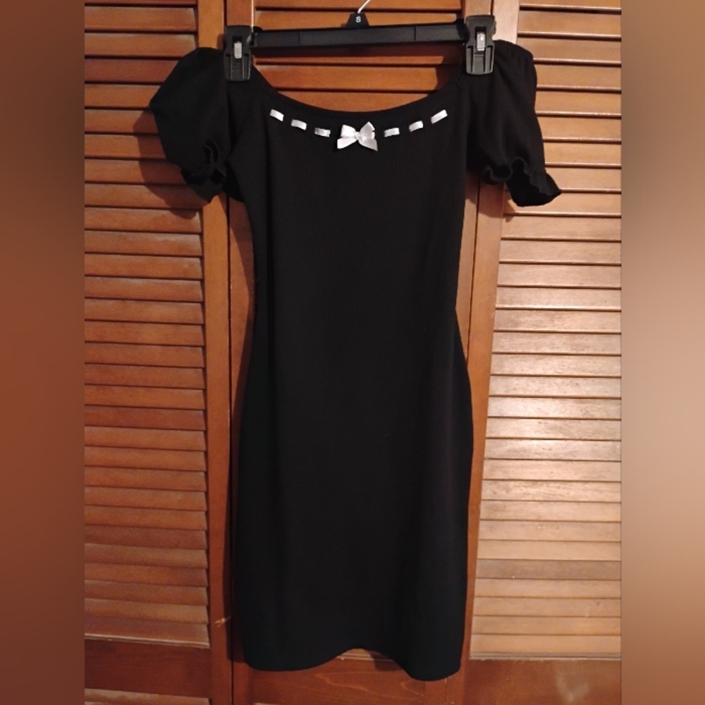 Liz And Sara Elegant Black Mini Dress with White Bow And Stitching Accents.